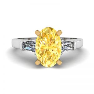 Anello con diamante giallo ovale con baguette laterali bianche